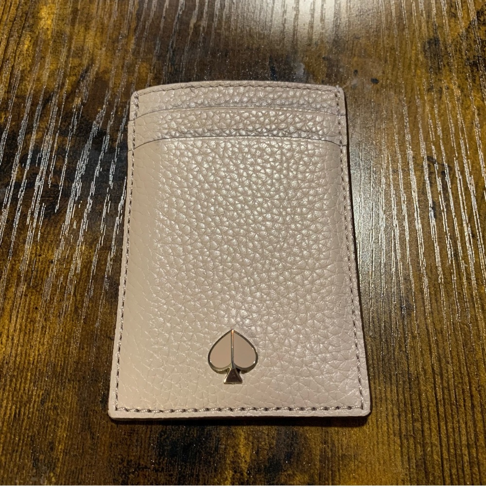 Kate Spade New York card holder with signature metal logo